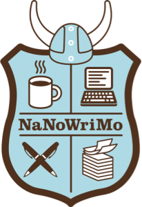 National Novel writing month logo a shield with crossed pens, a laptop and a cup of coffee on it with a viking helmet on top for some reason