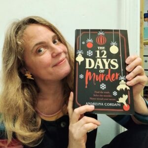 andreina cordani posing with a uk copy of the twelve days of murder